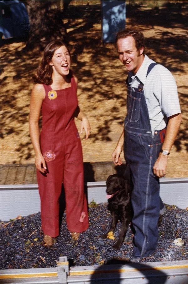 Janet and John Trefethen photographed in the 1970s with a bottle and glasses in front of the winery.