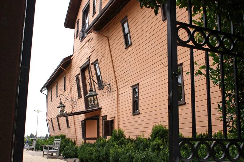 The winery one day after the 2014 earthquake, visibly out of true behind the iron gates.