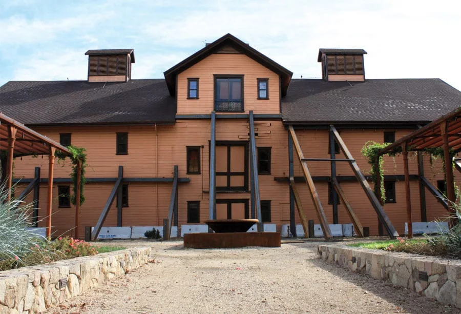 The winery during restoration, braced with heavy timber shoring against its walls.